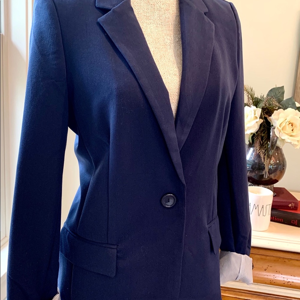 Blue cotton jacket with pinstripe lined cuffs.